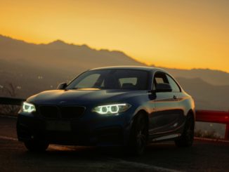 white and black bmw m 3 on road during sunset